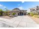 Beautiful two-story home featuring a three-car garage and desert landscaping at 2625 Cattrack Ave, North Las Vegas, NV 89081