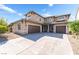 Two-story home featuring a spacious driveway and attached three-car garage at 2625 Cattrack Ave, North Las Vegas, NV 89081