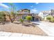 Two-story home featuring low-maintenance desert landscaping at 2625 Cattrack Ave, North Las Vegas, NV 89081