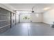 Spacious two-car garage with gray epoxy floors, a window for natural light, and plenty of room for vehicles and storage at 2625 Cattrack Ave, North Las Vegas, NV 89081