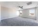 Large main bedroom featuring neutral carpet, ceiling fan and large windows providing great natural light at 2625 Cattrack Ave, North Las Vegas, NV 89081