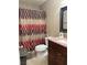 Bathroom featuring a shower with a curtain, tile floor, vanity and a toilet at 2701 Beaver Creek Ct # 201, Las Vegas, NV 89117