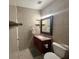 Small bathroom featuring a toilet, vanity, mirror, sink and tiled walls at 2701 Beaver Creek Ct # 201, Las Vegas, NV 89117
