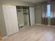 Bright bedroom boasts laminate floors, built-in closet organizers, and a window at 2701 Beaver Creek Ct # 201, Las Vegas, NV 89117