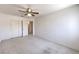 Inviting bedroom with neutral carpet, ceiling fan, and closet space, bathed in natural light at 2728 Aspen Wood Ave, Henderson, NV 89074