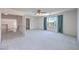 Bright, open bedroom with natural light from a window, carpeted floors, and a ceiling fan at 2728 Aspen Wood Ave, Henderson, NV 89074