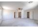 Large, carpeted bedroom with multiple closets and doorways offering ample space and natural light at 2728 Aspen Wood Ave, Henderson, NV 89074