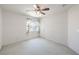 Comfortable bedroom featuring soft carpet, a ceiling fan, and a window at 2728 Aspen Wood Ave, Henderson, NV 89074