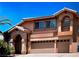 Inviting two-story home with a three-car garage and a landscaped front yard at 2728 Aspen Wood Ave, Henderson, NV 89074