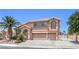 Charming two-story home with a three-car garage, desert landscaping, and a mature palm tree at 2728 Aspen Wood Ave, Henderson, NV 89074