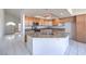 Open kitchen with granite countertops, central island, and tile flooring at 2728 Aspen Wood Ave, Henderson, NV 89074