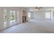 Large living room with fireplace and double doors leading to the backyard at 2728 Aspen Wood Ave, Henderson, NV 89074