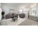 Inviting living room featuring neutral furniture and a bright, open layout with stairs to an upper level at 2728 Aspen Wood Ave, Henderson, NV 89074
