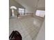 Sun-filled living room boasting tile flooring and an elegant chandelier at 2728 Aspen Wood Ave, Henderson, NV 89074