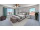 This primary bedroom suite features a beautifully staged bedroom with large windows at 2728 Aspen Wood Ave, Henderson, NV 89074