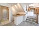 This home features a unique wet bar situated beneath the staircase with under-cabinet lighting at 2728 Aspen Wood Ave, Henderson, NV 89074
