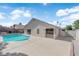 A large concrete deck surrounds this backyard's refreshing pool at 3115 Floral Vista Ave, Henderson, NV 89014