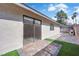This backyard's sliding door is set in artificial turf and pavers at 3115 Floral Vista Ave, Henderson, NV 89014