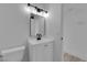 Well-lit bathroom with a vanity, mirror, and modern lighting at 3115 Floral Vista Ave, Henderson, NV 89014