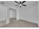 Bedroom with a ceiling fan and mirrored closet at 3115 Floral Vista Ave, Henderson, NV 89014