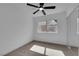 Bright bedroom featuring a ceiling fan, window, and mirrored closet at 3115 Floral Vista Ave, Henderson, NV 89014