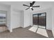 Bright bedroom featuring a ceiling fan, closet, and sliding glass doors to the outside at 3115 Floral Vista Ave, Henderson, NV 89014