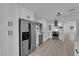 Bright, updated kitchen with stainless steel appliances and modern white cabinets at 3115 Floral Vista Ave, Henderson, NV 89014