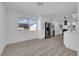 Bright kitchen features white cabinets, stainless steel appliances, and lots of natural light at 3115 Floral Vista Ave, Henderson, NV 89014