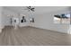 Open-concept living room featuring updated flooring, windows and recessed lighting at 3115 Floral Vista Ave, Henderson, NV 89014