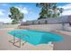 Cool, blue pool with ladder, set against a block wall backdrop at 3115 Floral Vista Ave, Henderson, NV 89014