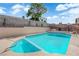 A ladder gives access to this backyard's inviting in-ground pool at 3115 Floral Vista Ave, Henderson, NV 89014