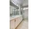 Stylish bathroom with dual glass vessel sinks, white cabinets, and walk in shower at 3200 Ridgecliff St, Las Vegas, NV 89129
