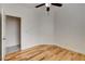 Bedroom featuring hardwood floors, ceiling fan and an open doorway at 3200 Ridgecliff St, Las Vegas, NV 89129