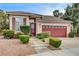 Charming single-story home with well-maintained landscaping, a tiled roof, and a two-car garage at 3200 Ridgecliff St, Las Vegas, NV 89129