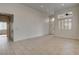Bright open living room with neutral paint, tile floors, and lots of space at 3200 Ridgecliff St, Las Vegas, NV 89129