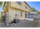 Exterior view of a backyard with a patio, privacy wall, and lush trees, perfect for outdoor living at 3905 Sweet Pine St # 102, Las Vegas, NV 89108