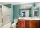 The bathroom features a shower-tub combo and a double sink vanity, illuminated by bright vanity lights and complemented by tile flooring at 3905 Sweet Pine St # 102, Las Vegas, NV 89108