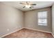 Bedroom with cozy carpet, a ceiling fan, and a window for natural light and ventilation at 3905 Sweet Pine St # 102, Las Vegas, NV 89108