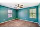 Comfortable bedroom with carpet, natural light from two windows, and a serene atmosphere at 3905 Sweet Pine St # 102, Las Vegas, NV 89108