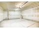 Spacious garage with concrete floor, lighting, and storage space offering functional utility at 3905 Sweet Pine St # 102, Las Vegas, NV 89108