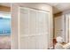 Hallway closet with louvered doors offering storage and organization in the living space at 3905 Sweet Pine St # 102, Las Vegas, NV 89108