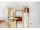 A cozy kitchen featuring tile floors, brown cabinets, and stainless steel appliances under recessed lighting at 3905 Sweet Pine St # 102, Las Vegas, NV 89108