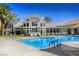 Beautiful outdoor pool with lounge chairs perfect for a relaxing day surrounded by a fence and greenery at 3905 Sweet Pine St # 102, Las Vegas, NV 89108
