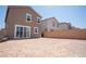 Spacious backyard with a gate and a patio area, perfect for outdoor activities at 3922 Painted Lady Ave, Las Vegas, NV 89141