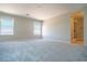 Spacious carpeted bedroom with natural light and attached bathroom at 3922 Painted Lady Ave, Las Vegas, NV 89141