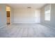 Large carpeted bedroom with bright natural light and access door at 3922 Painted Lady Ave, Las Vegas, NV 89141