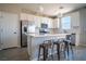 Stylish kitchen with white cabinets, stainless steel appliances, and an island with seating at 3922 Painted Lady Ave, Las Vegas, NV 89141