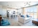 Open-concept living space connecting the kitchen and living room with ample natural light at 3922 Painted Lady Ave, Las Vegas, NV 89141