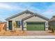 Charming single-story home featuring a quaint front yard and a two-car garage at 4404 Cave Lake Ave, North Las Vegas, NV 89032