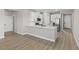Open-concept kitchen with white cabinetry, stainless appliances, and a stylish island at 4404 Cave Lake Ave, North Las Vegas, NV 89032